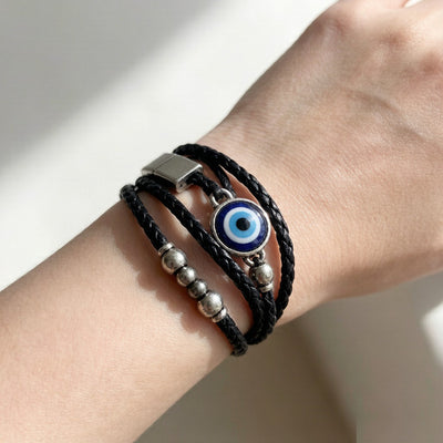 Gothic evil eye leather bracelet worn on wrist - lifestyle