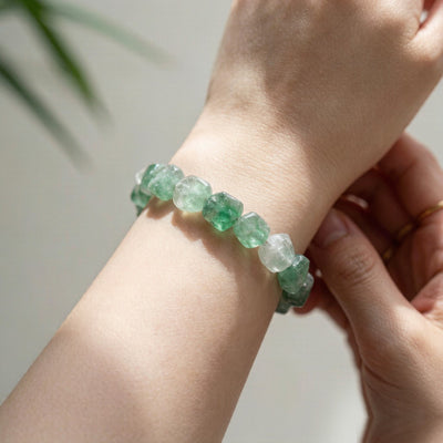 Natural green fluorite bracelet worn on wrist - lifestyle